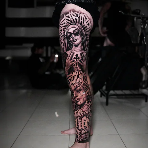 Black and grey leg sleeve tattoo with nun portrait and chicano lettering